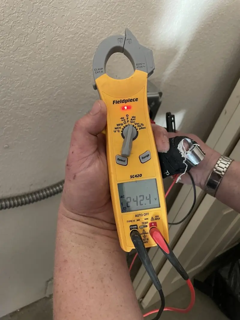 Voltage testing with clamp meter during Ceiling Fan Installation in Burtonsville